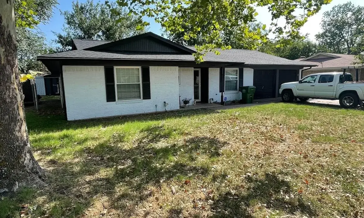 Professional roofing crew working on a residential roof in Lake of the Woods